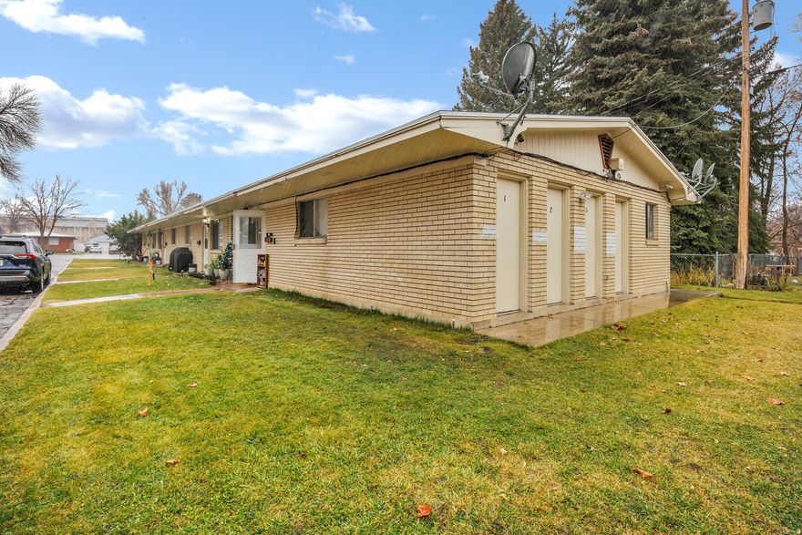 Great four-plex in the heart of Logan with strong long-term potential! Located just minutes from Utah State University, downtown, shopping, and restaurants, this property offers a central location that will consistently attract renters. Out front you will notice a bus stop, adding convenience for students, commuters, and everyday living. The property also features a coin-operated laundry, providing an additional income stream, along with a spacious shared backyard that backs a canal area, creating a unique outdoor setting rarely found with multi-family properties. Whether you're an investor looking to add to your portfolio or someone wanting to live in one unit and rent out the others, this four-plex offers flexibility and opportunity with room for future rent growth in a high-demand area. Buyer and Buyers Agent to verify all information.