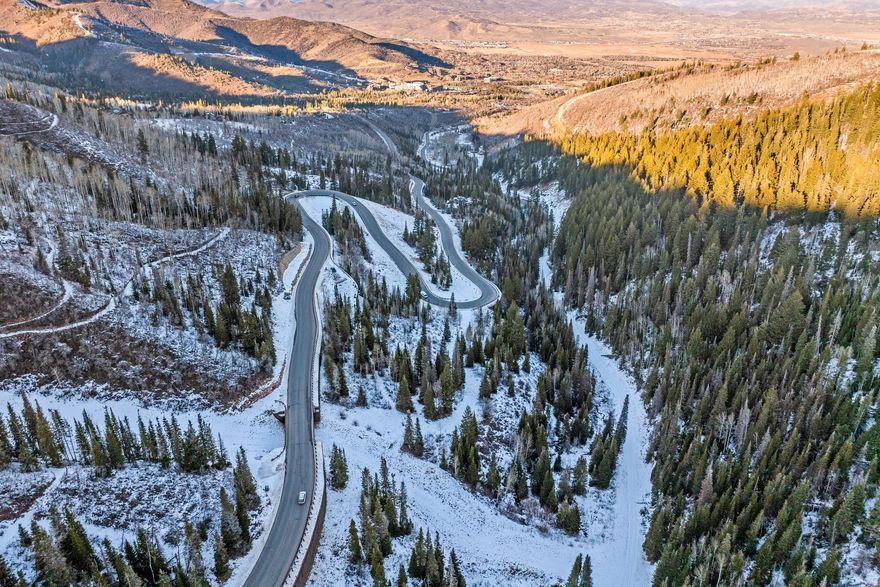 Set within the exclusive, gated community of The Colony, this rare ski-in/ski-out equestrian estate is an opportunity  to create a legacy mountain retreat within an incredible landscape. Encompassing 12.41 acres of pristine, wooded terrain, this exceptional equestrian-zoned parcel allows for three structures, including a main residence, guest house, and barn. Situated in the lower area of The Colony, the property enjoys close proximity to the Main Gate, offering a serene, private setting featuring mature trees, down-valley views, and a seasonal stream. Year-round adventures are just steps out the door with ski-in/ski-out access via the Whitewater Trail, with the option to ski down Cascade to either Iron Mountain Express or Timberline. Hiking and mountain biking trails bordering the property include access to the renowned 22-mile Mid-Mountain Trail connecting Deer Valley to the Utah Olympic Park and The Colony's Tranquility trail. In addition to four seasons of outdoor enjoyment, The Colony will feature a new homeowners club with fine-dining and events for homeowners. This Colony address is a rare legacy opportunity, offering decades of mountain enjoyment in one of Park City's most coveted settings.