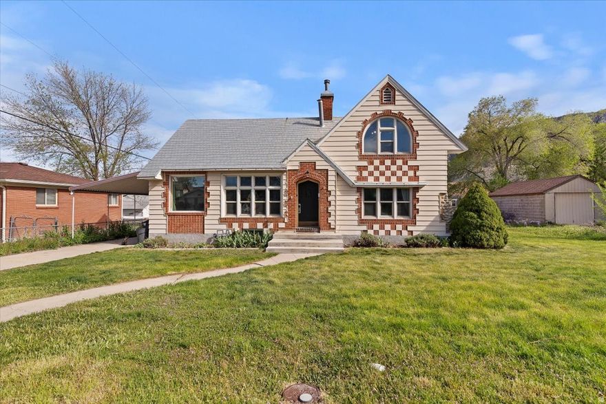 The definition of charming, this cottage-style home in Brigham City has a lot to love. Built in the 1920s, it still has so much of that original charm you just don't see very often anymore. The living room is a standout with vaulted ceilings and wood beams that make the space feel open but still really warm and inviting. You'll also find some of the original wood floors, along with a unique kitchen and bathrooms that give the home its personality.The exterior is honestly one of the best parts. It has that storybook, almost gingerbread-style look that makes it feel extra cozy and welcoming from the moment you pull up. Sitting on a quarter acre lot, there's plenty of space outside, plus a detached single car garage. You also get some nice updates like central air, so you're not giving up comfort to get the charm. Location is hard to beat. You're just minutes from Main Street with easy access to shops, restaurants, and everything downtown has to offer.  Square footage figures are provided as a courtesy estimate only and were obtained from the previous MLS.  Buyer is advised to obtain an independent measurement.