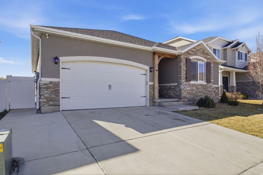 This spacious rambler sits on a quiet street in the established Miller subdivision and delivers over 3,500 square feet of finished living space with no HOA. Built in 2017 and featuring 5 bedrooms, 3 full bathrooms, and a fully finished basement, this home is move-in ready and perfectly laid out for everyday living and entertaining alike. The main level offers an open floor plan with a well-appointed kitchen featuring granite countertops, upgraded cabinets, and slate appliances. A convenient main-floor laundry room keeps daily routines simple. The primary suite includes a generous walk-in closet and a luxurious double-headed shower. Plantation shutters throughout add a polished, elevated feel. Downstairs, the finished basement provides two additional bedrooms, a full bathroom, and flexible living space with room to spread out. Step outside to a fully landscaped yard, automatic sprinklers, and a powered Tuff Shed ready for storage or projects. Located minutes from freeway access, shopping, dining, and top-rated schools in the Jordan School District, this home checks every box. Easy to show, easy to love.