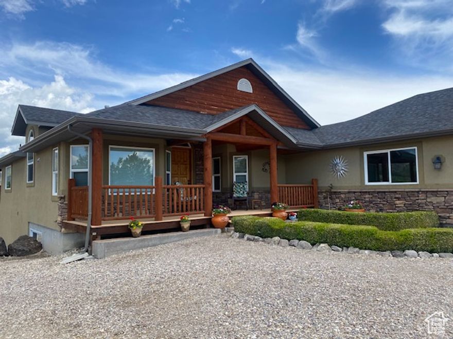 Gorgeous 3 bedroom/4 bath 3800 sq. ft home and 157.6 total acres with approx. 145 acres of farmable acreage. This incredible home and property is in a great location nestled at the base of the mountains with excellent hunting and recreational amenities nearby! Corrals, working pens with waterers, barn and hydrants for livestock watering located on the property. The home features a grand entry way, vaulted ceilings, fabulous kitchen with granite countertops, huge master bedroom and basement bedrooms, great room, fully finished daylight basement, bar and oversized family room with large fish tank, and pellet stove. Enjoy the views from the large trex deck with log railing overlooking the valley. There is also a 36x24 fully enclosed heated shop with concrete floors and two 24x14 bays with enclosed covered parking on each side with overhead doors. There shop also has a kitchenette and bathroom/shower that could be used as additional living space.  Must See! This is an excellent opportunity to enjoy country living!