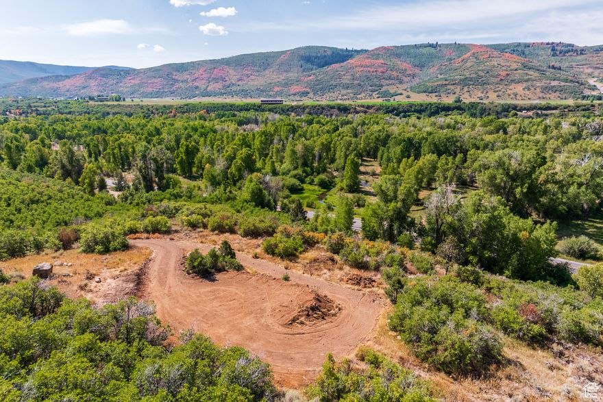 This incredibly rare 40-acre building lot in Woodland offers unmatched privacy, seclusion, and panoramic mountain views in every direction. Located just over a mile south of the red church on State Road 35, the property features a private driveway that winds up to a prime building site. This is a legal lot of record with Summit County and we are including a well permit with the purchase. Enjoy your own private canyon to hike and explore, plus the property is adjacent to Forest Service lands. The opportunities for outdoor adventure are endless! The property is not in an HOA and there are no CC&Rs. It is the perfect place to create your dream mountain retreat while enjoying the beauty and tranquility of the surrounding landscape.