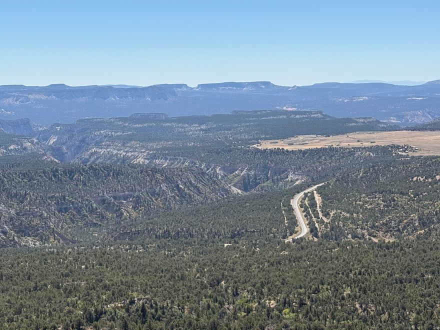 Located just outside Zion National Park, this expansive 700-acre ranch offers a rare opportunity to own productive land in one of the most iconic regions of the Southwest. The property features a one-room log cabin, a nod to the area's ranching roots, and wide-open grazing land capable of supporting up to 300 head of cattle. A natural spring provides an exceptional water source for a custom homesite, gardens, and livestock. With ample acreage the property balances refined seclusion with functional ranching capability. Few properties combine this level of beauty, water, and proximity to Zion.