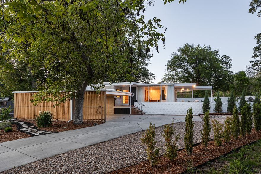 Ed Dreier homes are iconic pieces of mid-century architecture, and as such, we love to see them respected. This is another masterwork of his Salt Lake City portfolio, and it's been thoughtfully restored and lovingly maintained. Original details are intact throughout, and while modern updates have been made, it's only where they genuinely improve the living experience. Set privately at the end of a cul-de-sac with no rear neighbors, the home is canopied by mature trees on a generous lot. As you might expect, the home does exactly what the architect intended in connecting the interior and exterior seamlessly: floor-to-ceiling glass walls draw in both light and landscape in equal measure. Original wood paneling, concrete block walls, a stunning period fireplace with terrazzo mantle, and a stone entry remain fully intact, thanks to responsible ownership and a genuine appreciation for the architecture. The kitchen has been updated to meet modern needs without losing the home's sensibility-clean lines and minimal design lend themselves to convenience and easy gathering. Main floor living keeps daily life easy, and downstairs, you'll find two additional rooms that offer flexibility, whether it be for a wine cellar, studio, or private office. The lower-level bathroom is plumbed with gas and water for a future sauna. Situated between Sugar House and Holladay, this one has the privacy of a secluded setting and the convenience of both neighborhoods close at hand. Homes of this architectural significance, and restored to this standard, are genuinely rare-don't hesitate on this one. Square footage figures are provided as a courtesy estimate only. Buyer to verify all.