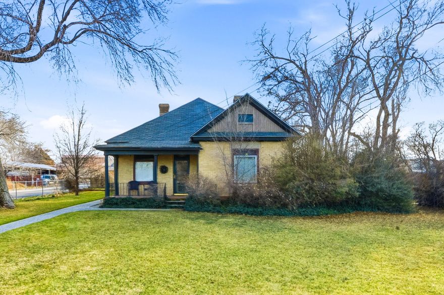 Your search can stop here!  This one acre of horse property will not disappoint.  You will find the most charming home that is updated and meticulously well cared for.  Featuring 3 bedrooms plus a 4th loft bedroom, 2 bathrooms, dining and living room, a sunroom, and a large root cellar/cold storage area.   Exposed brick walls and original stained glass will catch your eye.  Covered porch and deck, landscaped yard, mature trees, 3 car detached garage space, plus 2 covered parking spots, and ample RV and/or horse trailer parking.  Zoned agricultural - horses and/or other livestock animals allowed - you can finally get your chickens!  Multiple sheds, shop, chicken coup, barn, tack room, and large pasture - perfectly set up for horses and your little farm in the city. Full automated sprinkling system.  All plumbing and electrical has been updated. Fully fenced.  Convenient highway access. The list of features and possibilities are endless. Come see your slice of paradise!   Buyer advised to verify all listing information.