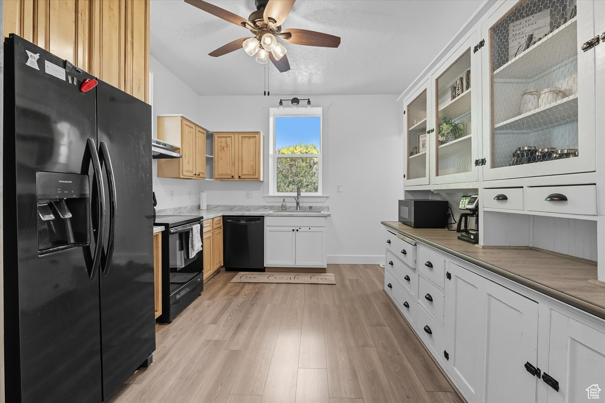 Price Adjusted! Wow, this Smithfield home is a total stunner! Completely redone from top to bottom, this 5-bedroom, 3 bathroom gem mixes old-school brick charm with all the modern vibes. You'll love the tall ceilings, fresh carpet, new LVP, and tile flooring inside. The kitchen's a dream with a huge pantry, and the bathrooms? Totally upgraded! The big primary suite in the basement is your own private hideaway, with it's own outside entrance. Out back, you'll find a cozy covered deck and a fully fenced yard, ideal for relaxing or throwing get-togethers. Plus, the front porch is begging for a lemonade-sipping session. Steps from walking trails, a park just half a block away, and super close to downtown Smithfield, this place has it all. Don't sleep on this beauty-come check it out!