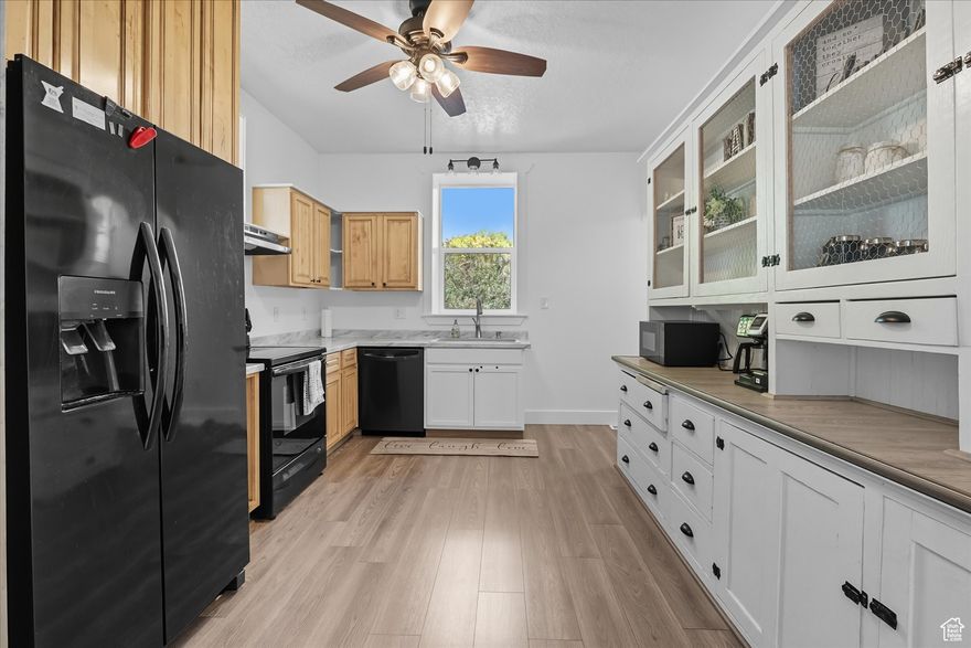 Price Adjusted! Wow, this Smithfield home is a total stunner! Completely redone from top to bottom, this 5-bedroom, 3 bathroom gem mixes old-school brick charm with all the modern vibes. You'll love the tall ceilings, fresh carpet, new LVP, and tile flooring inside. The kitchen's a dream with a huge pantry, and the bathrooms? Totally upgraded! The big primary suite in the basement is your own private hideaway, with it's own outside entrance. Out back, you'll find a cozy covered deck and a fully fenced yard, ideal for relaxing or throwing get-togethers. Plus, the front porch is begging for a lemonade-sipping session. Steps from walking trails, a park just half a block away, and super close to downtown Smithfield, this place has it all. Don't sleep on this beauty-come check it out!