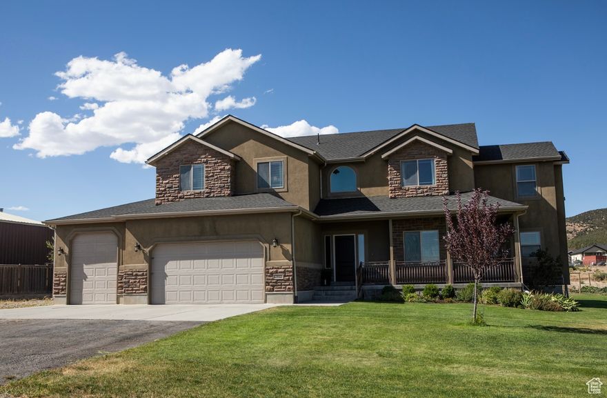 Motivated Seller! Make an offer!  Welcome to your dream home in the peaceful countryside of South Rim! Built in 2008 and thoughtfully updated, this home includes a new roof (2024), new water heater (2024), and brand new HVAC (heat pump for 2nd floor) (2025). This home features a beautiful open kitchen, granite countertops throughout, Luxurious Master suite featuring a huge walk-in closet and a spa-like bathroom with soaking tub, and a private office and private balcony. The home also features a dedicated theater room, large mud-room, spacious food storage room, several family rooms, separate entrance on side of house for side gigs like a salon, basement wet bar, and oversized 3-car garage with overhead storage, including a deep/tall bay with workshop and workbench. Outside you will find an amazing fenced-in garden and a mini orchard with peach, pear, apple, and plum trees, plus raspberries and strawberries on the fence line. Take in breathtaking mountain views, bright starry nights, brilliant sunrises, and unforgettable sunsets! Additional features include an automatic sprinkler system, automatic gardening watering system, in-ground wired dog fence, basketball court with hoop! Whether you're looking for a space to homestead or simply room to breathe, this property is waiting for you! Marketing video available upon request!  Square footage figures are provided as a courtesy estimate only and were obtained from seller. Buyer is advised to obtain an independent measurement.