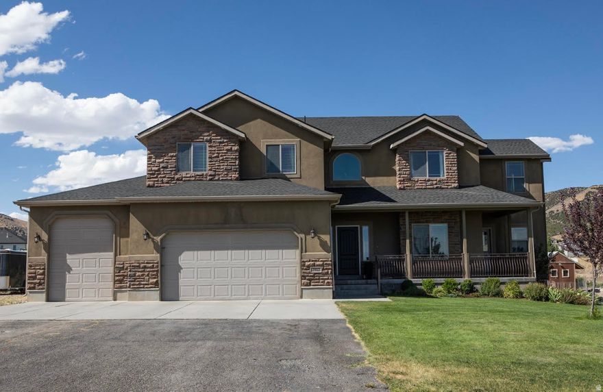 Welcome to your dream home in the peaceful countryside of South Rim! Built in 2008 and thoughtfully updated, this home includes a new roof (2024), new water heater (2024), and brand new HVAC (heat pump for 2nd floor) (2025). This home features a beautiful open kitchen, granite countertops throughout, Luxurious Master suite featuring a huge walk-in closet and a spa-like bathroom with soaking tub, and a private office and private balcony. The home also features a dedicated theater room, large mud-room, spacious food storage room, several family rooms, separate entrance on side of house for side gigs like a salon, basement wet bar, and oversized 3-car garage with overhead storage, including a deep/tall bay with workshop and workbench. Outside you will find an amazing fenced-in garden and a mini orchard with peach, pear, apple, and plum trees, plus raspberries and strawberries on the fence line. Take in breathtaking mountain views, bright starry nights, brilliant sunrises, and unforgettable sunsets! Additional features include an automatic sprinkler system, automatic gardening watering system, in-ground wired dog fence, basketball court with hoop! Whether you're looking for a space to homestead or simply room to breathe, this property is waiting for you! Marketing video available upon request!  Square footage figures are provided as a courtesy estimate only and were obtained from seller. Buyer is advised to obtain an independent measurement.