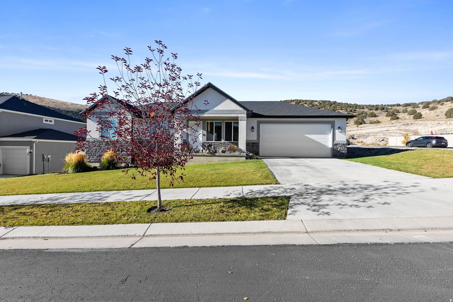 Enjoy the best of Utah living surrounded by hiking and biking trails, breathtaking views of the valley, lake, and mountains. Welcome to a friendly neighborhood with excellent schools, brand-new shopping and amenities just minutes away. This beautifully maintained home shows like a model! This is one of Eagle Mountain's most desirable and fastest-growing communities. Every detail has been cared for with pride and intention, making this residence truly move-in ready. From the moment you arrive, you'll appreciate the reinforced concrete driveway offering long-term durability and secure footing. The insulated garage door and sealed, clean concrete flooring create a perfect space for storage, projects, or a personal workshop. Step inside to find a bright, welcoming interior highlighted by new premium wood blinds in three rooms, color-adjustable light-control blinds in two others, and new kitchen blinds for a fresh, modern look. The primary suite features a spacious layout, walk-in closet, and elegant hip ceilings. Outdoors, the landscaping has been freshly updated with layered, barked flowerbeds, a durable weed barrier, and crisp, low-maintenance design for year-round beauty. This is more than a home-it's a lifestyle of peace, pride, and outdoor enjoyment.