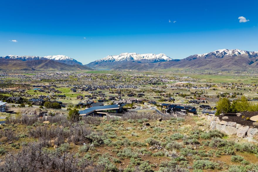 Positioned near the top of Red Ledges, 1647 A1 Peak Circle (Lot 562) offers a rare one-acre homesite with sweeping, unobstructed views across the Heber Valley and toward Mt. Timpanogos. The gently sloping terrain is ideally suited for a custom residence with a walkout lower level, thoughtfully designed to capture the surrounding landscape and natural light.   Ownership provides access to Red Ledges' private club lifestyle, including the Jack Nicklaus Signature Golf Course, Golf Park and practice facilities, clubhouse dining, resort-style pool, tennis and pickleball courts, fitness center, equestrian program, and miles of scenic trails. And in the winter, private shuttles offer easy access to Deer Valley Resort and the recently opened East Village. A Golf Membership is available with a separate deposit, and the Twin Creeks water bond assessment has been paid in full. Engineered building plans by Michael Upwall, for a 7,625 square foot luxury home, area also available.