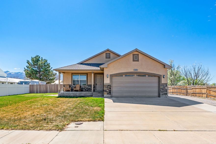 This great home has main level living with room to grow with it's full basement, mostly finished. Main level has formal living room, family room combined with kitchen, 3 bedroom/2 bathrooms and the laundry room. Basement has another bedroom, storage areas, living room- ready to finish to your needs. Basement is also plumbed for bathroom. Gun safe is included.  Large, covered RV parking and separate ATV garage/workshop in back yard. Home has a large patio, a fully fenced yard and fixed lighting in the eves. Includes 1/4 share of Fillmore Water Users irrigation water and large swing set.