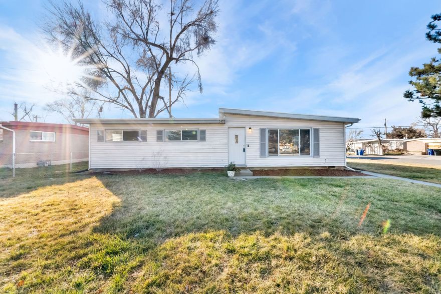 Cute and comfortable 3-bedroom home located in a desirable West Valley neighborhood! This light-filled home has been thoughtfully updated and offers peace of mind with a 5-year-old membrane roof, new carpet, and 1-year-old laminate flooring.  Major systems have been recently upgraded, including a 3-year-old Amana HVAC system featuring a 96% efficiency variable-speed furnace paired with a 16 SEER air conditioner. You'll also appreciate the 1-year-old commercial-grade A.O. Smith water heater, 2-year-old fencing, and a 1-year-old Tuff Shed for extra storage.  The tuff shed also features a rock climbing wall on the side for fun with the kids.  The spacious yard provides plenty of room to relax, entertain, or play. Conveniently located near parks, schools, shopping, and freeway access, this home makes everyday living easy.  Schedule your personal showing today!