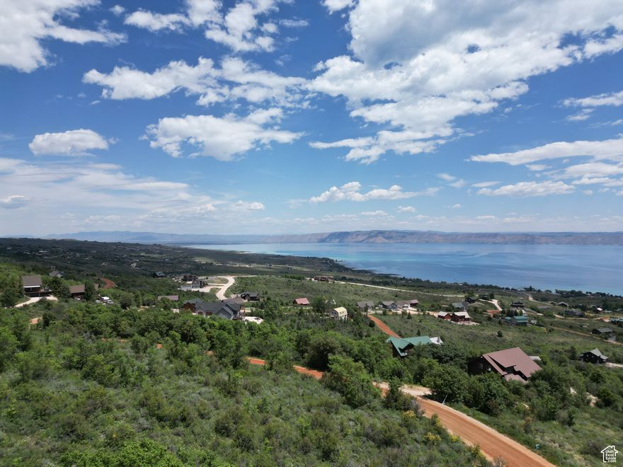 Top of the Bear Lake West, wooded secluded building lot.  Views of Bear Lake from north to south.  Build your Bear Lake Hideaway or escape to live your dream in away from the hustle.  Year around access, amenities include members discount for golf, summer outdoor heated pool, beach access for BLW owners only, pickleball / tennis courts. Adjoining lot to the north is also available.  No short term rentals in this HOA