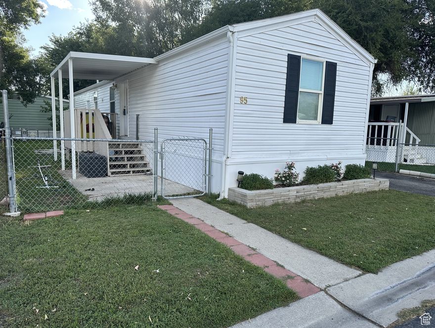 $10,000 offered in concessions with a full price offer! Ask selling agent for details. MUST SEE this like-new, beautifully-maintained 3 bed 1 (extra large) bathroom home. It is the lowest priced mobile home in this sought after, centrally located Provo community! Conveniently located across the street from the clubhouse, pool, and other amenities, with the perfect combination of comfort, style and convenience. With furnishings negotiable, this perfect home is truly move in ready! Buyer to verify all information.