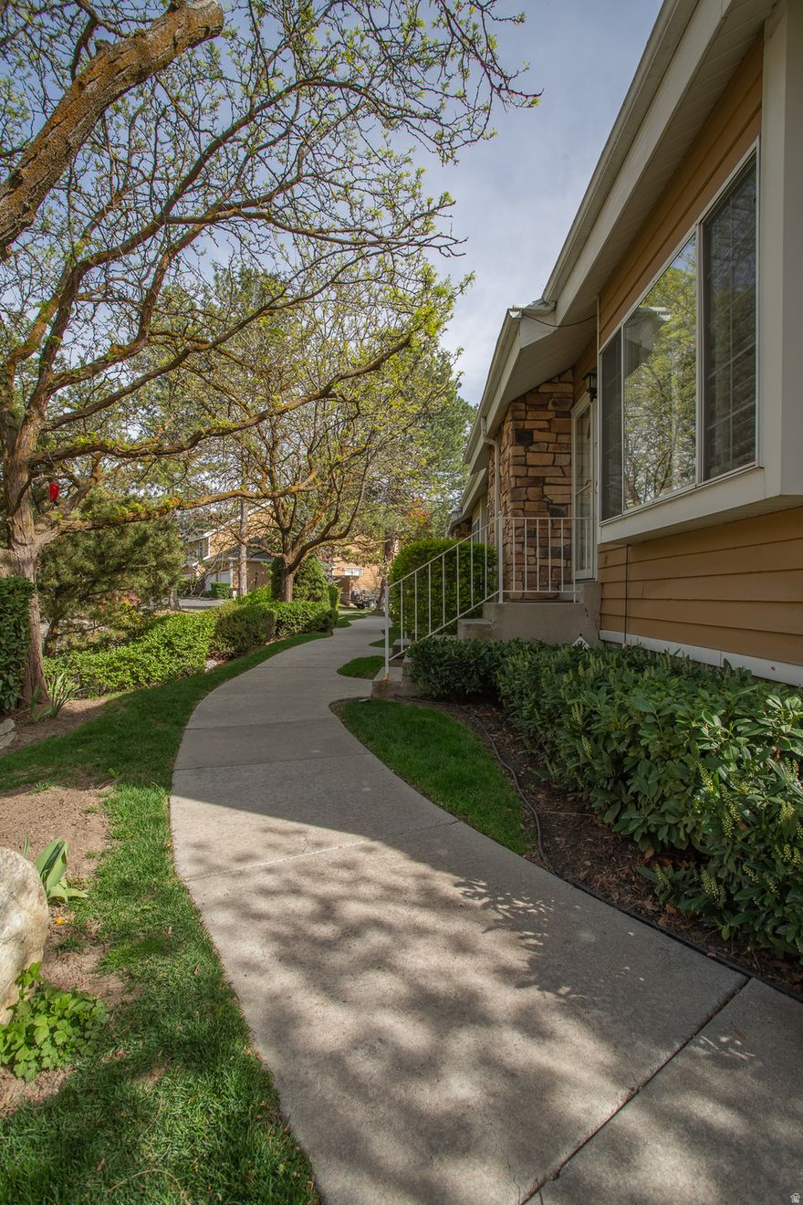 Peaceful views of the running creek off of the back balcony.  Very nice. Newer kitchen with granite counter tops. All appliances stay. New furnace in 2025. Plantation shutters throughout.