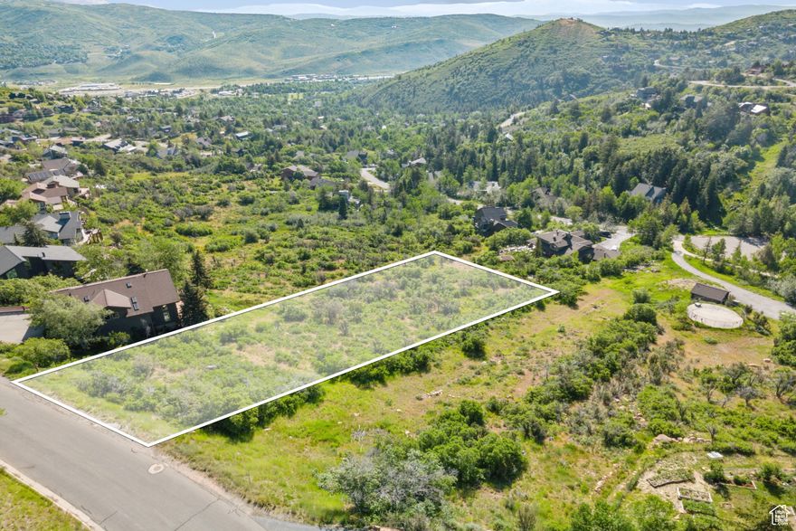 Live where you play on this nearly one-acre Pinebrook homesite, perfectly positioned for year-round mountain adventure. With miles of hiking and biking trails and nine ski resorts within an hour, this lot puts Park City's legendary outdoor lifestyle right at your doorstep. This nearly one-acre sanctuary is bathed in soft morning light and year-round southern sun. The gently sloped parcel of land offers the perfect blend of privacy and natural beauty. A public easement along the side ensures additional space and seclusion, enhancing the sense of quiet luxury.  Included with the property are architecturally designed plans for a 4,246 sq ft modern mountain residence, curated for both style and function. The vision features a main-level primary suite, home office, four bedrooms and six baths, and an optional one bedroom, one bath, 735 sq ft ADU apartment that is ideal for extended-stay guests or luxe multigenerational living. Walls of glass, expansive decks, and open-concept living are designed to frame the surrounding alpine landscape and elevate every moment at home.  With a geotechnical report already complete, this property is a turn-key opportunity to create a legacy property in one of Park City's most desirable, year-round communities.