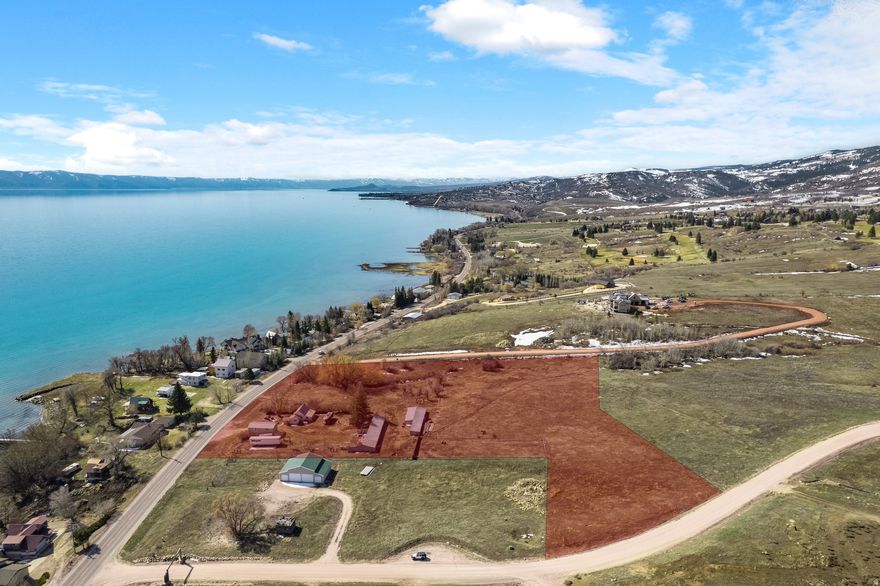 This stunning 7.24-acre parcel in Fish Haven, Idaho, offers a rare opportunity to own a spacious piece of land with breathtaking views of Bear Lake and private beach access. Opportunity to subdivide or develop up to 7 LOTS. Nestled in a serene and scenic setting, this property provides ample space to build your dream home, family retreat, or investment property while enjoying the beauty of the surrounding mountains and crystal-clear waters of Bear Lake. With easy access to outdoor recreation, including boating, fishing, hiking, and ATV trails, this location is perfect for those who love nature and adventure. Whether you're looking for a peaceful getaway or a year-round residence, this property offers unmatched views, privacy, and access to one of the region's most sought-after destinations. Don't miss this incredible chance to own a slice of Bear Lake Idaho paradise. Property includes 2 parcels, 711 and 725 US Hwy 89. 2 parcels being sold together. Includes 20' wide lake access.