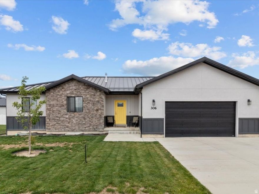 INCREDIBLE NEW PRICE! This deal can't be beat in the entire area! Motivated sellers! Nearly 3,300 sq ft at this value-don't miss your chance to own this gem on a quiet street with stunning mountain views! Built just over two years ago, this better-than-new home features a fully landscaped yard with automatic sprinklers-no extra work needed. Enjoy bright, open living spaces with high-end upgrades, including a durable metal roof with snow stoppers. Main floor living at its best with gorgeous quartz counters throughout. The chef's kitchen includes stainless steel appliances, quartz countertops, a stylish backsplash, and ample storage-all appliances stay! Spacious primary suite with double vanity, walk-in closet, plus two more bedrooms and a full bath. The large unfinished basement offers huge potential-add 23 more bedrooms, another bathroom (pre-plumbed), and a rec room to build even more equity. Extras include Trimlight exterior lighting (programmable for holidays), smart switches, and a smart doorbell. HUGE side yards- almost a quarter acre, and plenty of parking for cars and toys. This home is a true treasure-make it yours today!