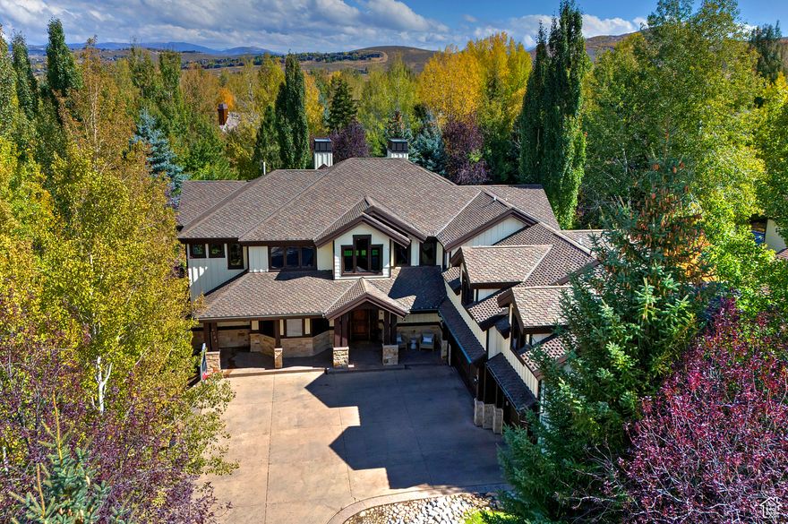 Nestled in one of Park City's most desirable neighborhoods, this 5,742 sq. ft. home perfectly blends space, function, and style. The main level offers an easy, open flow that extends to a private fenced backyard with mature landscaping, a large patio for outdoor dining, a cozy fire pit, and direct access to neighborhood trails and open space. A covered outdoor living area makes it easy to enjoy the mountain lifestyle year-round.  The spacious main-level primary suite features a walk-in closet and an adjoining den, ideal for a home office or quiet reading space. The second level includes generously sized bedrooms and a large family room with a fireplace, wet bar, and private bath, perfect for guests or movie nights. The floor plan is designed with everyday living in mind, offering ample storage and flexible spaces throughout.   Recent updates include interior and exterior paint, a new bathroom addition and upgraded mechanical units. An oversized, heated three-car garage includes epoxy floors, Tesla EV charger, dog wash, and built-in storage.  Conveniently located between Park City's historic Old Town and Kimball Junction, this home is just 35 minutes from Salt Lake City International Airport and in close proximity to world-class skiing at Deer Valley, Park City Mountain, Canyons Village, and the new East Village Deer Valley expansion. Outdoor enthusiasts will love nearby Willow Creek Park, with its playgrounds, pickleball and tennis courts, dog park, and trail connections.  Zoned for the highly regarded Parley's Park Elementary, this home captures the essence of Park City living- space, comfort, and easy access to everything you love.