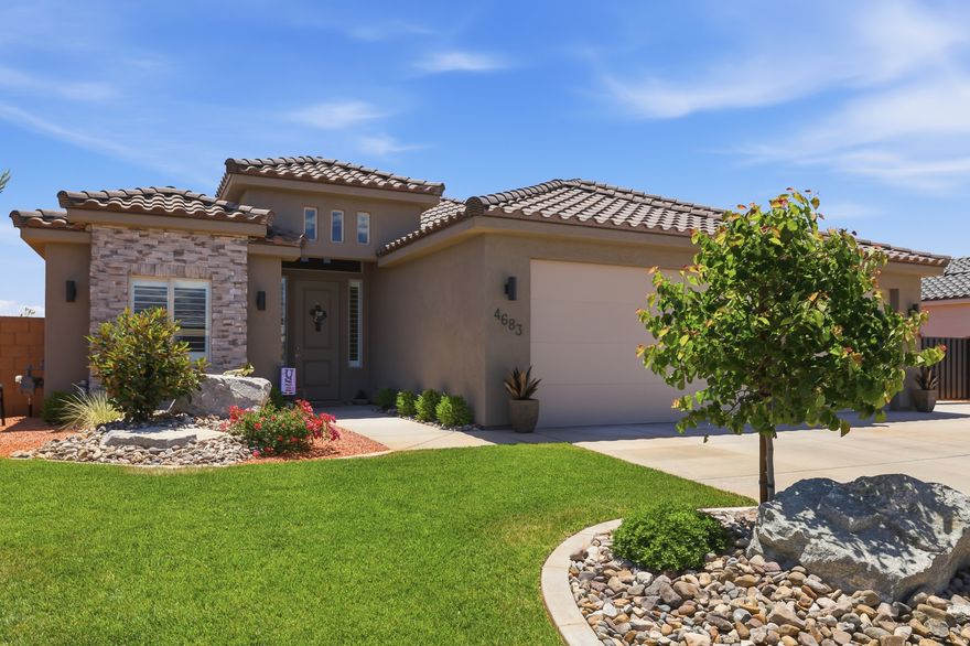 Welcome to your new home in the highly sought after Sedero at Desert Sands community in Hurricane, Utah. Located just across from Sand Hollow Reservoir, this beautifully upgraded home offers the perfect combination of comfort, style, and Southern Utah living.  Inside, you'll find LVP flooring throughout, elegant three tone paint, plantation shutters, and fully covered windows, including blackout shades in the primary bedroom for added comfort and privacy. The thoughtfully designed kitchen features an induction stove and opens seamlessly to the main living area, creating an inviting space for gathering and entertaining.  The upgraded primary bathroom offers a relaxing retreat, while the tankless water heater adds efficiency and convenience. Outside, the fully fenced yard with custom gates provides privacy and functionality, along with an impressive 46 foot RV pad with plenty of room for a motorhome, trailers, boats, and extra toys.  The HOA maintains the yard, making it easy to enjoy low maintenance living while spending more time exploring Sand Hollow, nearby golf courses, hiking trails, and everything Southern Utah has to offer.  Whether you're looking for a full time residence, second home, or the perfect basecamp for adventure, this home truly stands out.  Square footage figures are provided as a courtesy estimate only and were obtained from county records.  Buyer is advised to obtain an independent measurement.