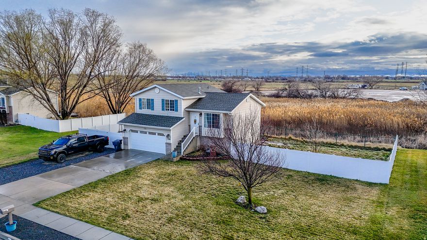 ***Price Improvement***  Clean, open, and full of light! This tri level home sits on a huge .48 acre lot in quiet Plain City. Dead end street with no backyard neighbors. Brand New Water Heater, Newer LVP flooring, quartz kitchen countertops, covered Trex deck, permanent lighting, hot tub whip, newer insulated garage door and opener, 14 x 75 RV pad, and shed. Hard to find space this close to everything. Seller willing to contribute $2,500 towards carpet allowance!
