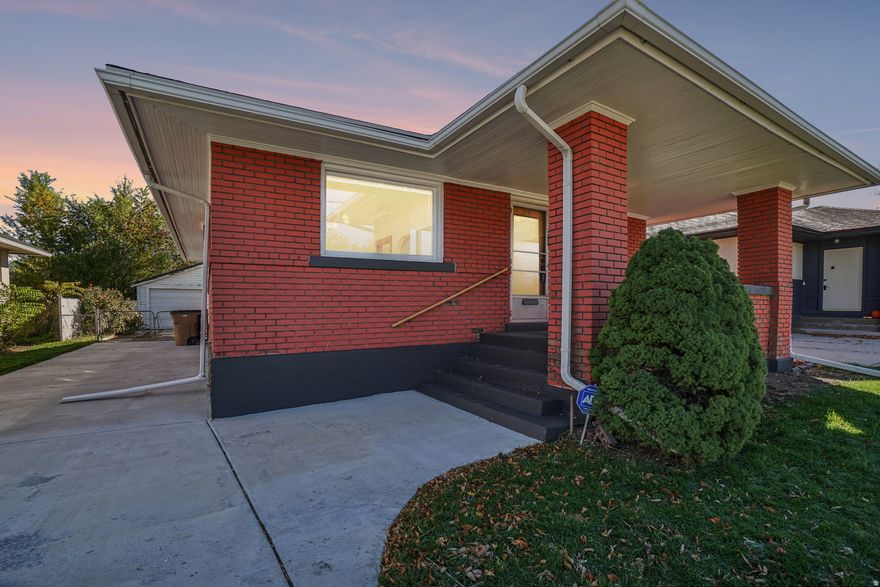 Just a few blocks from Liberty Park, this timeless bungalow blends classic character with thoughtful updates. You'll love the beautiful original hardwood floors, authentic Craftsman woodwork, and cozy working fireplace. Vintage fixtures and hardware add a touch of elegance, while modern updates make daily living easy, featuring a nicely refreshed kitchen, canned lighting, new carpet, and fresh paint throughout. Major systems have been updated for peace of mind, including a new furnace and A/C (2021), new PEX plumbing (2023), updated electrical, and a newly poured concrete driveway (2021). Relax on the back covered porch with a morning coffee, and enjoy the convenience of your rare oversized 1-car garage-a true find in this neighborhood! It's perfect for extra storage, a workshop, or keeping your car snow-free all winter. Conveniently located just half a mile from Trax, this home offers the perfect balance of charm, comfort, and location. All appliances are included, just move in and enjoy!