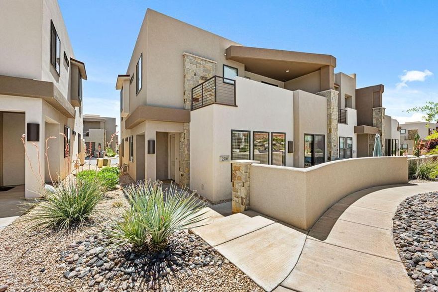 Turn-key short term rental in Town Center at Coral Canyon! This modern and fully furnished property offers an open-concept layout, plenty of natural light, and 5 bedrooms with 4 bathrooms. The spacious kitchen features quartz countertops, modern cabinetry, stainless steel appliances, and a large island ideal for entertaining. Enjoy two private covered patios with beautiful mountain views, including an upper-level deck complete with a hot tub and lounge area. The community offers resort-style amenities and is conveniently located near; Zion National Park: 32 miles away, Snow Canyon State Park: 24 minutes, Sand Hollow, Pioneer Park, and Quail Lake State Park: 5-minute drive. Downtown St. George: 10 minutes away. Whether you're looking for an investment property, vacation home, or weekend getaway, this low-maintenance retreat is ready to go with income potential and modern desert style throughout.