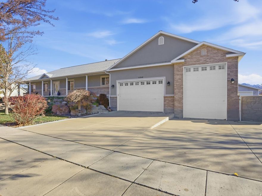 One of a kind ... will go fast! This rambler and property is tough to find - especially in a location so close to shopping, restaurants, schools and anything else you might happen to need. This home was renovated in 2017 and has been meticulously cared for. Upstairs has a large primary bedroom with 2 large walk-in closets, a beautifully custom-built bathroom and walk-out deck overlooking a spectacular filtered koi pond and waterfall.  Its gorgeous dark hickory hardwood floors lead to a spacious dining room, front room and family room with a floor to ceiling grey-stone gas fireplace, huge walkout back deck, 2 additional bathrooms, laundry room/sink and 2 more spacious rooms. The adjoining kitchen has all the extras including a double oven with warming drawer, double sink, Bosch dishwasher, gas stove, freezer/fridge, extensive walk-in pantry and beautiful granite counter with room for up to 4 bar stools. The finished walkout basement is perfect for a potential ADU and includes a dual zone furnace/AC, top of the line Radon mitigation system, 2 spacious bedrooms/closets, large game/exercise room with 3 additional closets, family room with gas fireplace, full kitchen with all the amenities, huge laundry and cold storage areas.   The fully fenced yard includes 2 covered patios, fire pit, 8-person hot tub, fully lit gated garden with 14 raised garden boxes, raspberry bushes, grape vines, apple and plum tree - all surrounded by beautiful flowering trees. Property includes garage space for 6 vehicles, RV parking, a double car garage/shop and a large extra area for more RV or recreational vehicles. Square footage figures are provided as a courtesy estimate only. Buyer is advised to obtain an independent measurement.