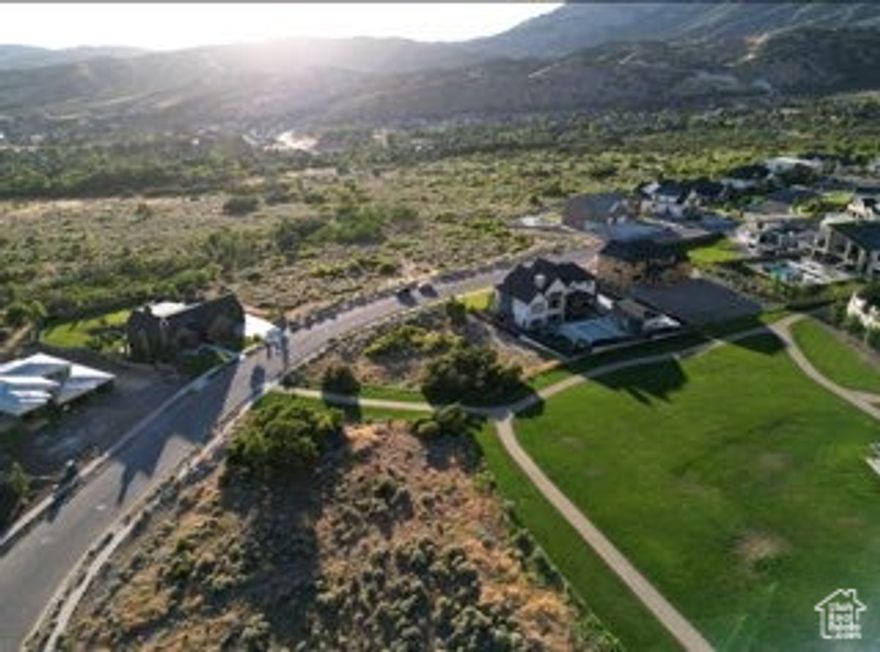Prime Half-Acre Lot in Exclusive Lambert Park Estates. Build your custom dream home in the prestigious Lambert Park Estates, home to numerous Utah Parade of Homes award-winning multi-million-dollar residences. This rare 0.5-acre lot offers breathtaking views of both the majestic mountains and Utah Lake, with direct backyard access to a community park. West facing lot means summer shade in the evenings and sunshine driveway for Alpine winters. Perfectly located just minutes from Silicon Slopes, Utah's technology hub, this lot is ideal for world-class mountain biking, hiking, and enjoying the renowned Alpine wild poppy fields that bloom in May-June. Bring your own builder and start creating your forever home today!