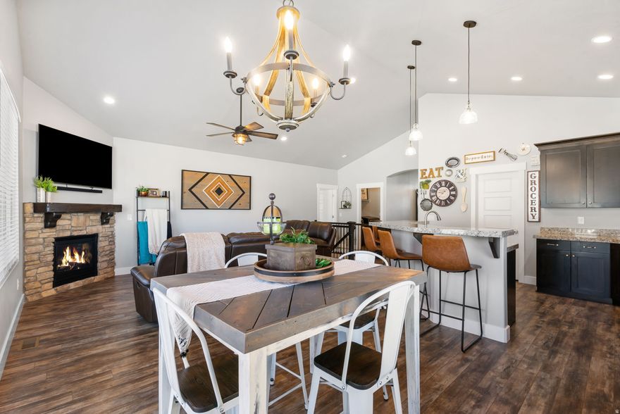 This home has the light, bright, open feel you're looking for with its extra-tall ceilings in every main-floor room.   The open great room and kitchen are designed for both everyday living and entertaining, with abundant natural light adding to that airy, welcoming vibe.  The kitchen is both beautiful and functional, featuring upscale granite countertops, upgraded cabinetry, and a walk-in pantry-the kind of storage you've always wished you had, whether you're cooking on a busy weeknight or hosting friends.  The main-level primary suite feels like a retreat with a large, open bedroom. The spa-like bath has a separate tub and shower, a private toilet room, and generous closet space-an easy place to rest and relax at the end of the day.  Downstairs, you already have a head start with one finished bedroom, plus an unfinished basement area that's ready for your vision-build equity and tailor the space to your lifestyle, with the potential to expand the home up to a total of 6 bedrooms and 3 full bathrooms. Create the space you need next-more bedrooms, a second living area, or room to spread out-without giving up what you love about this home.  Outside, you get a wraparound patio, beautiful landscaping, and the everyday practicality of a 3-car garage, all tucked on a quiet cul-de-sac. From this East Bench Tooele location, commuting toward the Salt Lake Valley is straightforward via SR-36 and I-80-giving you the best of both worlds: the space and views at home, and still close enough to where you work and play.  And if you haven't been to Tooele County recently, you'll be pleasantly surprised at all the new shopping, eating and playing options there are.  Come explore!  Pictures don't do it justice. Come see it in person to truly experience how open and bright it feels.   Bonus: ALL APPLIANCES ARE INCLUDED!