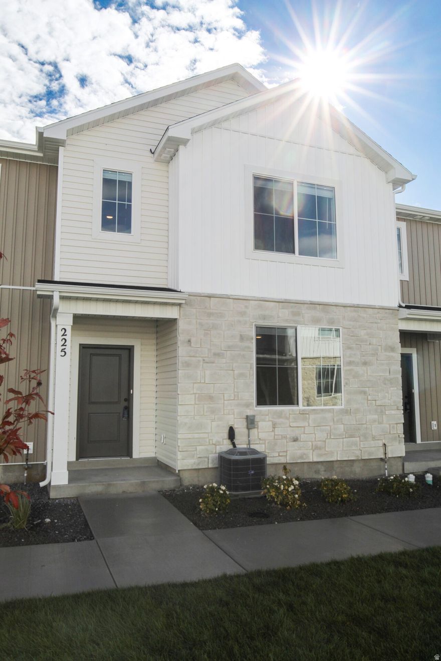 Seller offering a $10,000 incentive PLUS a fridge, washer, and dryer for a limited time! Also take advantage of the $20,000 first time home buyer grant from the state of Utah! Come check out this beautiful NEW townhome in an amazing community! This home has a 2 car garage, a large open kitchen and living space with high quality finishes including quartz countertops, LVP flooring, and stainless steel appliances. Upstairs you'll find 3 bedrooms, including a large primary suite with its own walk in closet. Pre plumbed for a water softener. Garages are fully insulated. We use blown in insulation. Premium high pylon carpet and carpet pad. Enjoy all the amazing community amenities like the premium clubhouse, pool, spa, dog park, pavilion, basketball court, pickleball court, & playground. Enjoy beautiful views from this incredible location as well. HOA covers all exterior landscaping maintenance, exterior building maintenance, snow removal on driveways, property & liability insurance coverage, trash and internet up to 1 gig of high speed fiber optic. Two year builder warranty included. Pictures are of a previously built unit. Scheduled to be move in ready in October. Square footage figures are provided as a courtesy estimate only and were obtained from sales brochure. Buyer is advised to obtain an independent measurement.