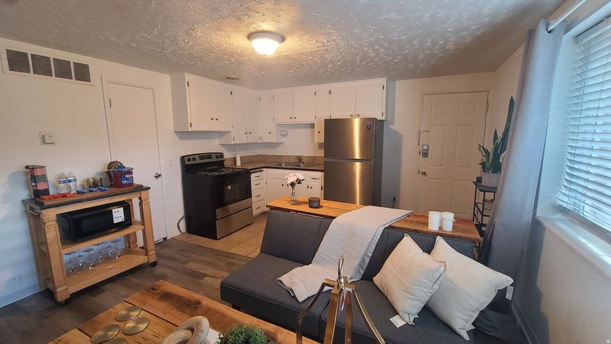 ONE OF A KIND OPPORTUNITY! Lowest price in the valley for a nice condo!. Own your own home in Salt Lake for UNDER $145K!  Features: New paint, New Woodgrain Laminate Flooring, New Refrigerator, New Range/Stove. Ready to move into with FURNISHINGS INCLUDED! Excellent Central Location that has great access to entire Valley.  Located just minutes away from local shopping, schools and freeway access.  On site laundry (in complex). Must see! POSSIBLE SELLER FINACING. Possible non-conventional financing available Call Listing Agent for details.   **Unit #0 located on lower-level NW corner of W building**