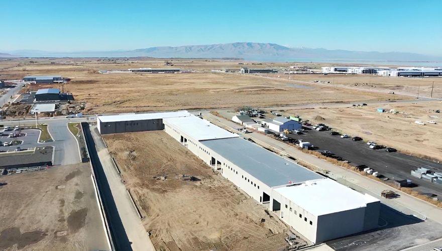 Prime Light Industrial Space in Spanish Fork with attached yard space! FIve large brand-new industrial units are available for lease. These units offers the perfect blend of functionality and flexibility.   With high ceilings, a large garage door, I-1 zoning, it's ideal for a variety of business uses. The space includes a dedicated office space with a bathroom, while the rest remains open for versatile use to transform to fit your specific needs. Set for completion by late summer or early fall, this is a great opportunity to secure a high-quality space in a growing area. You may have the option to lease multiple units. The attached yard space is an additional $0.32 per sqft.  Contact agent for more information.   Buyer and buyer's agent to verify all information, including square footage, zoning, and permitted uses. Information is deemed reliable but not guaranteed.