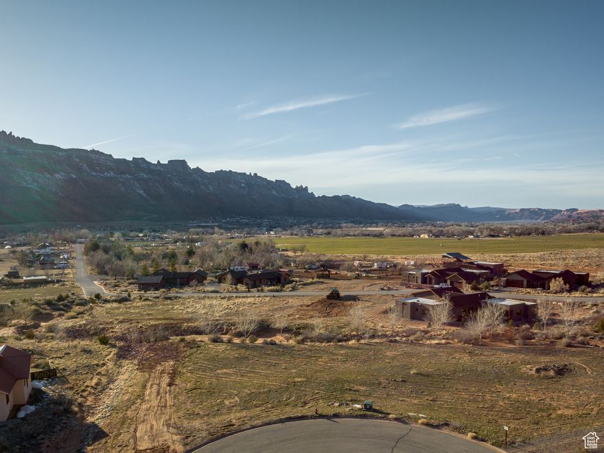WHITE HORSE 18- All great adventures have a base camp... welcome to White Horse, Moab's truly original residential development designed for outdoor enthusiasts. Celebrate the beauty of Moab and all that the region has to offer, from mighty rivers to red rock canyons, slickrock formations to snow-capped peaks, and the very best of outdoor adventure. This lot has fantastic views of the rugged beauty that surrounds Spanish Valley, with peaceful starlit skies to take your breath away each night. Located at the top cul-de-sac next to open space, this lot has an amazing setting. White Horse has been carefully designed to minimize traffic flow, sounds, and roadway views, located in a peaceful valley setting a perfect distance from the heart of town. The common area of White Horse show cases the natural high desert landscape, with hundreds of native plants, grasses, and trees. Utilities are in place, this lot is ready for you to build!