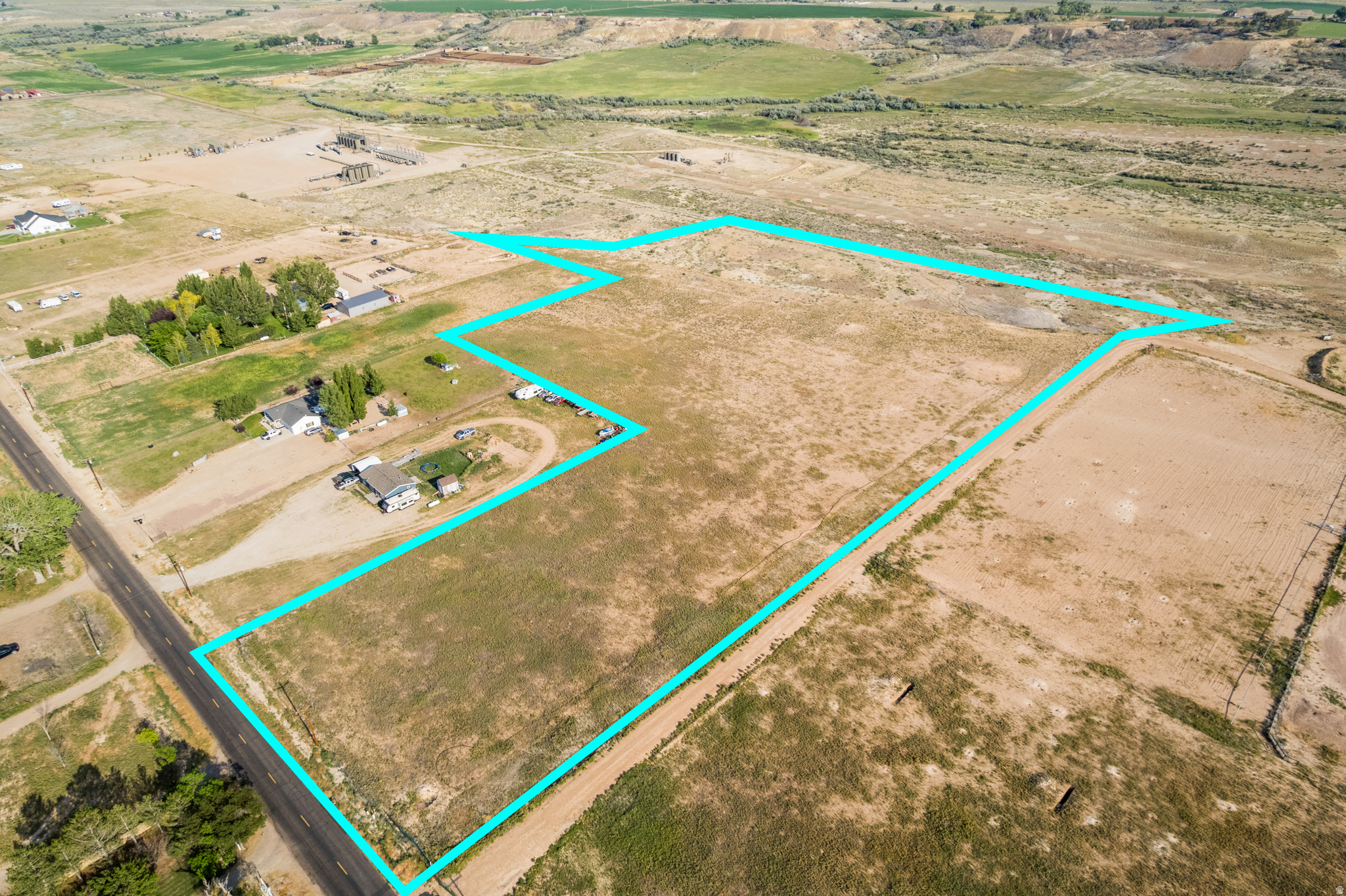 Expansive land parcel with direct paved road frontage