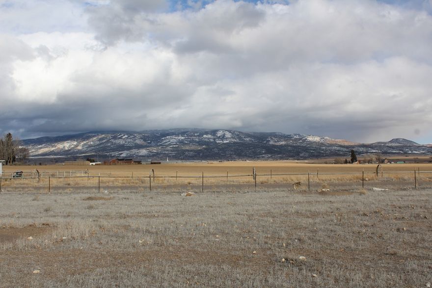 One full acre in the Boulder View Homesites Subdivision Located on the southwest edge of Loa. Pretty mountain views with farm fields in the forefront. Ready to build with city water and electricity stubbed to lot line. Level land for building. Fully fenced. Reasonable deed restrictions. Lot 15, Boulder View Homesites Subdivision, Loa.