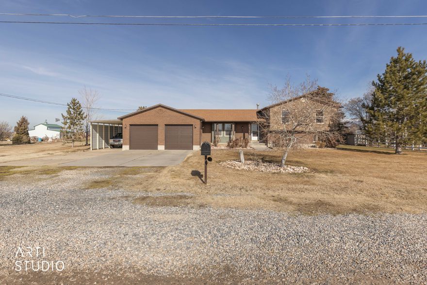 **OPEN HOUSE - Saturday, February 14th - 11:00 - 2:00 PM** Welcome to this spacious and versatile property located on 1.2 acres in Hooper. This well-maintained home offers 5 bedrooms and 3 bathrooms, providing plenty of room for comfortable living, entertaining, and flexibility for a variety of lifestyles. The property features a 2-car attached garage, a 22x33 detached garage, and an impressive 40x60 workshop with 12' overhead doors, making it ideal for hobbyists, business owners, or anyone needing exceptional storage and workspace. There is a 7' deep surface well with pump. Water hose bid by hitching post in culinary water. Recent major updates add peace of mind, including a new furnace installed January 2025, a new roof installed in 2021, and a new water heater installed in 2021. Enjoy the privacy and freedom of country-style living with space to spread out, while still being conveniently located near amenities. Properties offering this combination of land, outbuildings, and functional living space are rare - don't miss this opportunity. Square footages are from an appraisal. Kitchen refrigerator is excluded; fridge in garage is included. Fridge in large workshop is excluded. Buyer/Buyer's Agent to verify all. Sale is subject to seller securing a replacement property.