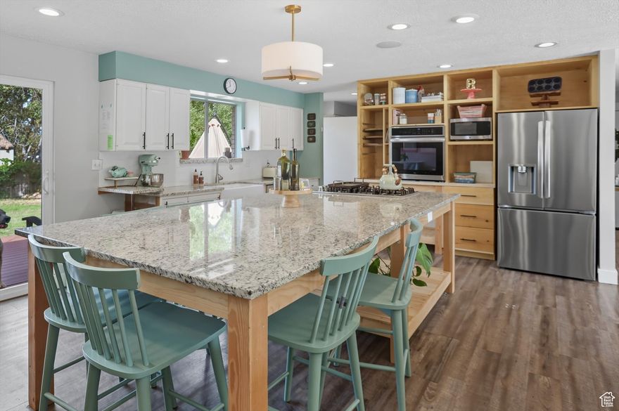 Welcome Home! Step into this beautifully updated 5-bedroom, 2 3/4 bathroom home located in the highly sought-after area of South Ogden. Enjoy an abundance of natural light pouring in through the floor-to-ceiling windows, creating a warm and inviting atmosphere. The open floor plan seamlessly connects the living spaces, making it perfect for entertaining. The kitchen is a baker's dream, featuring stunning granite countertops and ample space for all your culinary creations. Don't miss out on this incredible opportunity! Priced to sell quickly, this home is a must-see. Schedule your visit today and experience the charm for yourself!   Square footage figures are provided as a courtesy estimate only and were obtained from tax data search. Buyer is advised to obtain an independent measurement.