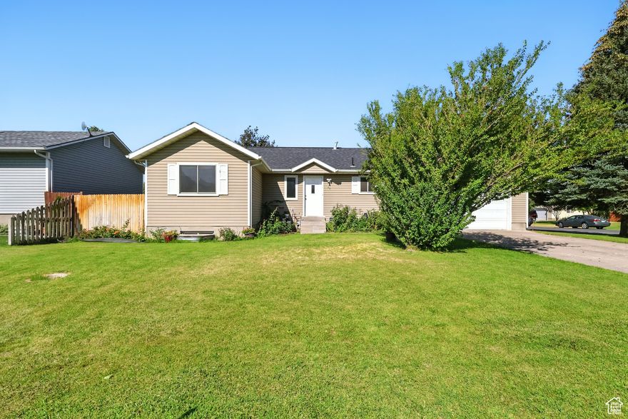 Affordable Deal!!! Don't miss the chance to own this 4 bedroom, 2 bathroom home on a corner lot with beautiful mountain views. With a fully finished basement, 2 car garage and a backyard with mature fruit trees ( peach, cherry and nectarine ) for your own homegrown harvest.