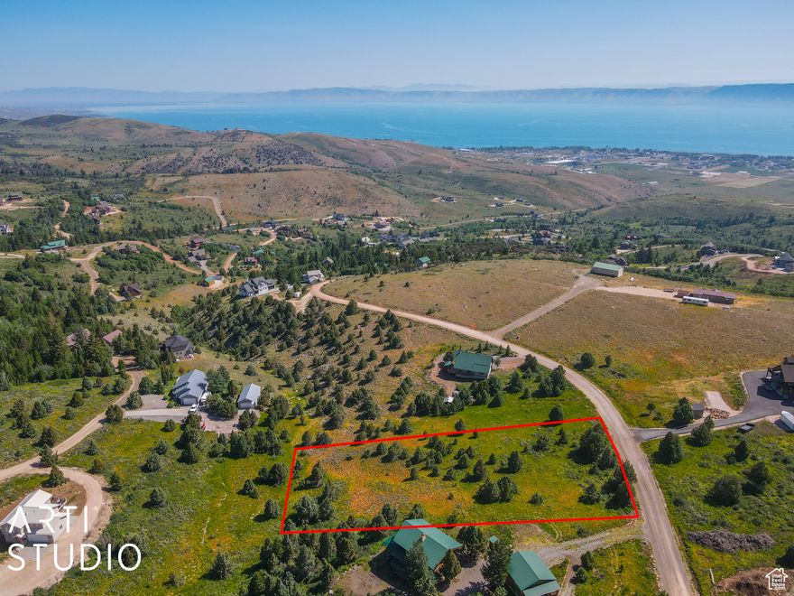 Discover your mountain paradise on this stunning 1.12-acre lot in the coveted Bridgerland Village Subdivision. Nestled just above the pristine Bear Lake, this picturesque parcel offers an exceptional opportunity to create your dream retreat. With easy access to National Forest lands, Logan Canyon, and Beaver Mountain, adventure is right at your doorstep. The lot features a gentle slope ideal for construction, ensuring a seamless build and captivating vistas from every angle. Enjoy breathtaking views of the surrounding mountains and the serene lake below, all while benefiting from the privacy and tranquility this exclusive location provides. Whether you're looking for a peaceful escape or a base for outdoor exploration, this property perfectly balances convenience with natural beauty, making it the perfect canvas for your mountain getaway. Boundary lines are provided as a courtesy only. Buyer is advised to obtain independent measurements.