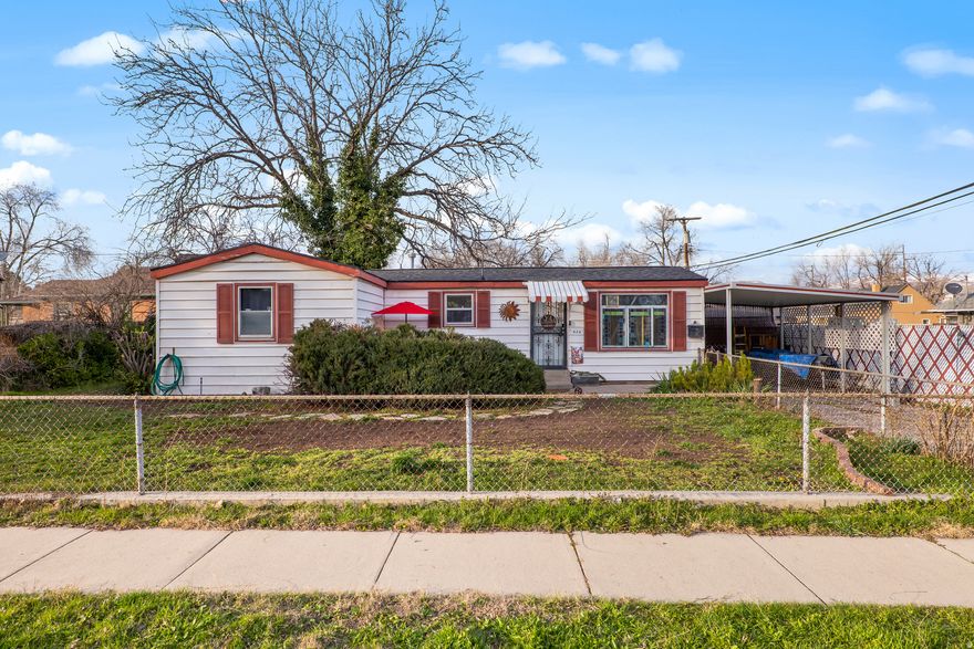 Are you looking for quiet living but city life right around the corner? This beautiful, updated home is minutes from Downtown SLC, but within walking distance of the Jordan Park and International Peace Gardens. This home has seen so many updates, yet it's kept the charm that keeps the original feel alive.  Brand new roof installed in 2026, completely renovated bathroom with modern style, new flooring, plumbing and electrical has had some updates as well all within the last 2 years! Fully fenced and secluded backyard. Storage space in the sheds out back, and covered parking with the carport.  Don't miss out on this beautiful home!  All information is deemed reliable but buyers agent to verify and confirm all information.  **The Chandelier in the Baby's room will be excluded from the sell along with the drapes covering the windows.