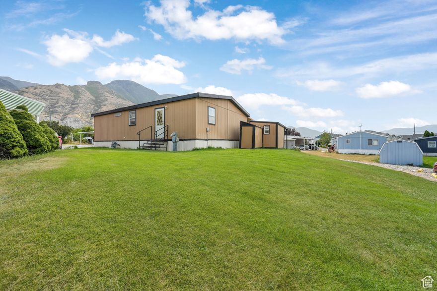 SPECIAL!! 3 Months Lot Rent PAID!! Move-In Ready w/New Carpet & Paint!  Rarely available South Willow home with amazing mountain views. Don't miss this opportunity to own a  thoughtfully maintained manufactured home in the highly sought-after South Willow community. Built in 1992, this 1,320 sq ft double-wide home offers an inviting open floor plan with 3 bedrooms and 2 bathrooms, including one recently updated bathroom. The spacious primary suite features a walk-in closet and full bathroom for added comfort. Updated hot water heater and a great roof that has 15 years remaining on its warranty. **Financing available with as little as 5% down** Contact agent for details. Step outside and enjoy your oversized yard w/full sprinkler system, flower garden, double wide parking and extra privacy from the cul-de-sac location. There is also an exterior shed that includes a workbench and is great for storage.  Enjoy a quiet lifestyle in an incredible location with remarkable views from your covered deck constructed from long lasting Trex decking.  The double wide driveway has plenty of room to park and ramp access to the home. South Willow community is nestled in southeast Provo, facing the Wasatch Mountain Range!  The perfect location with easy access to freeways, shopping, restaurants, and park, this home is also near the FrontRunner station and within close proximity to BYU and UVU. Amenities include a newly added basketball and pickleball court, a relaxing pergola and upgraded clubhouse, and quiet, well-kept lots that make for peaceful living.  Walk to playgrounds and open space at the large Spring Creek park that borders the neighborhood.Buyer must get approval with HOA before purchase.  The lot fee is $949/month for new owners.
