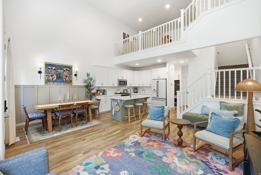 Welcome to this stunning Bluffdale home that truly feels like a model!  Designed with high-end finishes, thoughtful upgrades, and everyday livability in mind. This 5-bedroom, 3.5-bathroom home features a bright, open layout with premium LVP flooring, quartz countertops throughout, and designer touches like accent walls, wainscoting, and custom cabinetry.  The kitchen is a showstopper! It features upgraded appliances, a double gas oven, an included Cafe line refrigerator and elegant finishes that flow seamlessly into the main living space. Perfect for entertaining or relaxing at home. Upstairs, the primary suite offers a private retreat with a custom closet and a beautifully upgraded bathroom. The spacious loft adds flexibility for work or a perfect secondary living space.  The fully finished basement expands your living space with a built-in entertainment area, fireplace, and an additional bedroom or flex space with its own bathroom.  Ideal for guests or multi-generational living.  A new washer and gas dryer with pedestals are also included to make moving effortless and convenient.    From smart home features and upgraded lighting to a Level 2 EV charger and included appliances, every detail has been thoughtfully curated.  Located in a desirable Bluffdale neighborhood near parks and schools. This move-in ready home offers the perfect blend of luxury, comfort, and convenience.