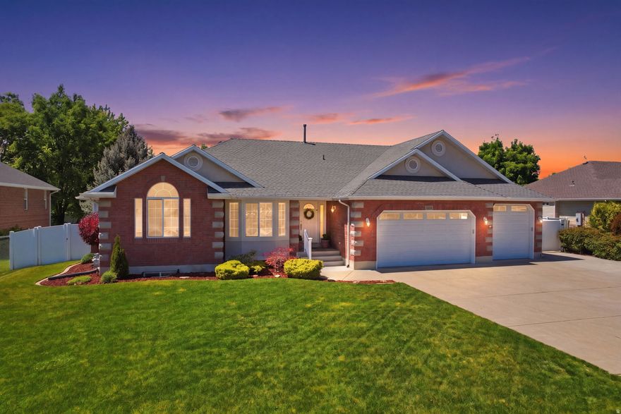 Welcome to Whispering Willow, ideally situated right along the border of Layton and Kaysville, where spacious living, timeless updates, and an incredible backyard come together on a rare .37-acre lot. This beautifully updated rambler features vaulted ceilings, an open concept layout, and rich real hardwood floors that bring warmth and character throughout the main living spaces. The kitchen, dining, and family room flow seamlessly together, creating the perfect setup for both everyday living and entertaining around the cozy fireplace with a separate formal living space just off the main entrance.  The spacious primary suite offers a walk-in closet, separate tub and shower, and a true retreat feel. Downstairs, the fully finished basement adds substantial additional living space with endless flexibility for entertaining, plenty of storage, three additional bedrooms and a den or flex space. Step outside to a private backyard designed to be enjoyed, complete with mature landscaping, a covered patio, storage shed, garden space, and RV parking with room for all the toys. The driveway is so oversized a three point turn is easily accomplished. Conveniently located near shopping, trails, walking distance to Layton Hospital, with quick access to I-15 and the West Davis Corridor for an easy commute to Salt Lake City or Ogden. This home truly checks all the boxes for space, function, and lifestyle