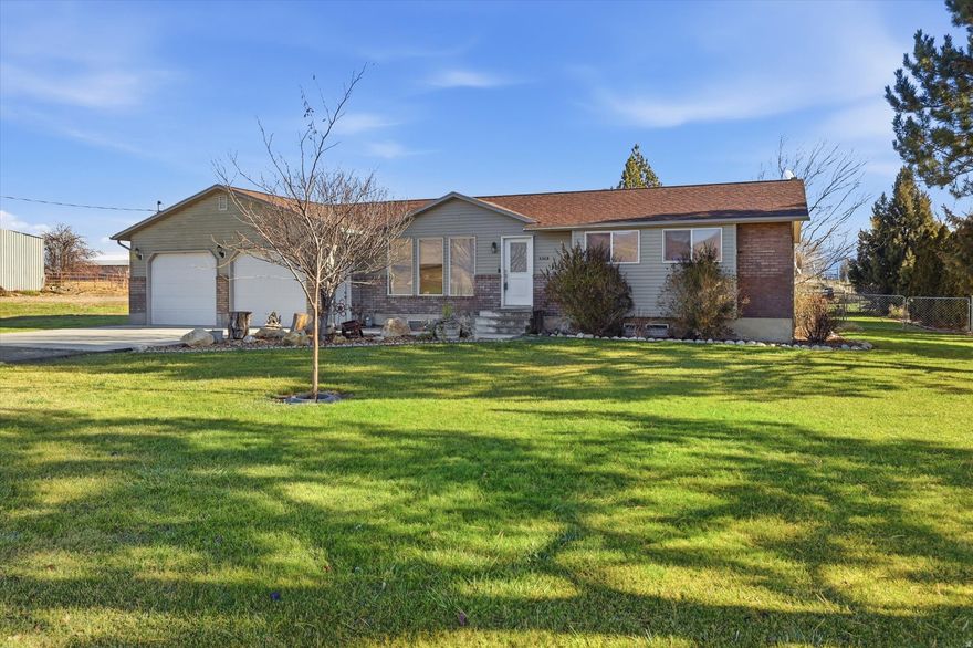 Nestled on the outskirts of town, this completely updated home has so much to offer! Updates throughout include new basement windows, sliding doors, fresh paint, and updated flooring. Step outside to a gorgeous yard with plenty of room for horses, gardens, or your favorite outdoor hobbies. Water shares are included, making this the perfect property for enjoying country living while still being close to town conveniences.  Includes Tax parcel #s 05-109-0031 and 05-109-0029