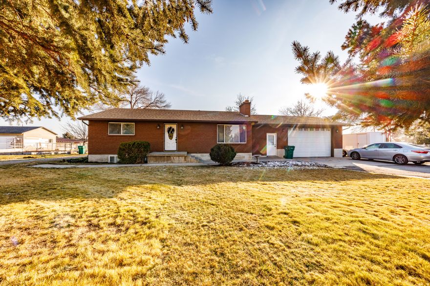 ***Interest rate as low as 3.25%***  Exceptional investment opportunity that truly checks all the boxes. Situated on 1.06 acres in a prime, well-established area of Highland, this horse property offers multiple income streams, long-term upside, and a peaceful country lifestyle. Buy outright or Seller Finance Option: 30 year amortization with 7 year balloon. Choose from the following options: #1:  $200K down, 4.25% interest. Seller finance option #2: $300K down 3.75% interest. Option #3 $400K down 3.25% interest. The rambler's main floor provides true single-level living with a primary suite, second bedroom, laundry, and an attached 2-car garage. The basement is a fully separate 2-bedroom apartment with private entrance and its own laundry-ideal for rental income or house hacking. The 28'X40' oversized detached garage/workshop is a standout feature, complete with an automotive service pit! Plus extensive parking outside for multiple RVs, trailers, or other vehicles. The yard includes a generous garden box area, an orchard full of fruit trees, and additional sheds and outbuildings. The land offers ample room for expansion or future use, adding significant value and flexibility. Located on the southern border of Highland, just up the road from American Fork Junior High and Legacy Elementary. Close to Fox Hollow Golf Course, North Utah County Equestrian Park, Canal Blvd, and other major thoroughfares, this property delivers quiet country living with convenient access to shopping, dining, and entertainment. Seller Finance Option: 20 % down, 3.99% interest, Balloon payment due in 7 years.