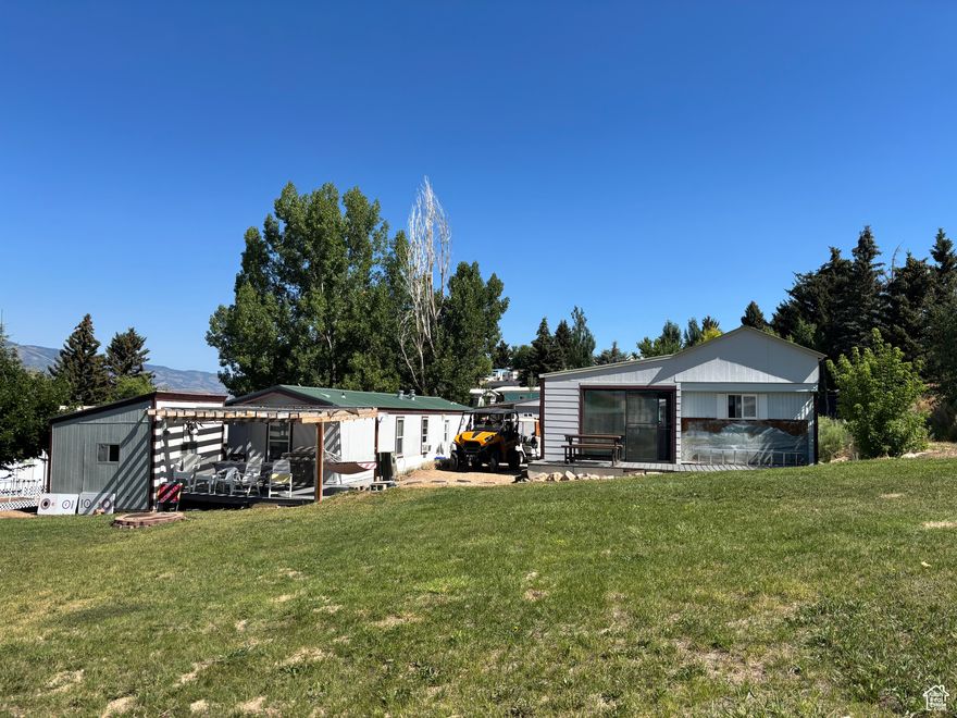 Includes 2 homes and 2 lots  963 & 971 Breeze Way, plus a bunk house. Sleeps 20 between the two homes.   Two decks and one with pergola, 2 storage sheds, 14x30 carport/awning, large grassy common area behind homes with auto sprinkler system. Semi-private decks with views of the mountains and valley. Great for family reunions and get together. Fire pit, furnishings, beddings, kitchen supplies all included.