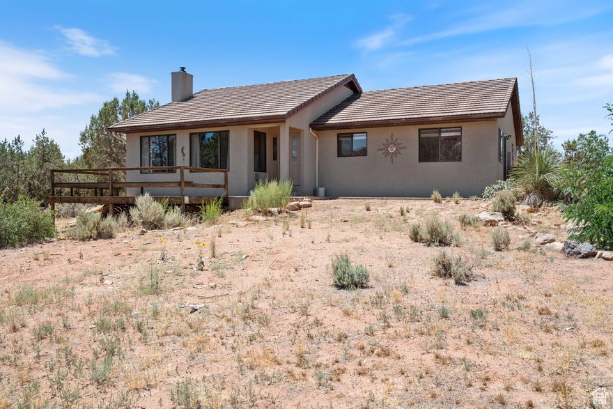 Views, Views and did we say, VIEWS! This amazing home has a front porch to the world, boasting scenic vistas of Zion National Park without paying the Zion Canyon prices. Well maintained home that is located in Southern Utah's red rock country with lots of outdoor activities at your doorstep or stay inside to enjoy the quiet serenity to comes with living on a large 1-acre lot. Nestled atop a hill, you have sweeping views of the surrounding mountains and valleys, trees and natures handiwork right in your back yard.  Literally...in your yard! Stay warm by the wood burning stove or enjoy cold air conditioning on warm summer days. Great opportunity for your permanent residence, second home or getaway retreat. Come see for yourself.