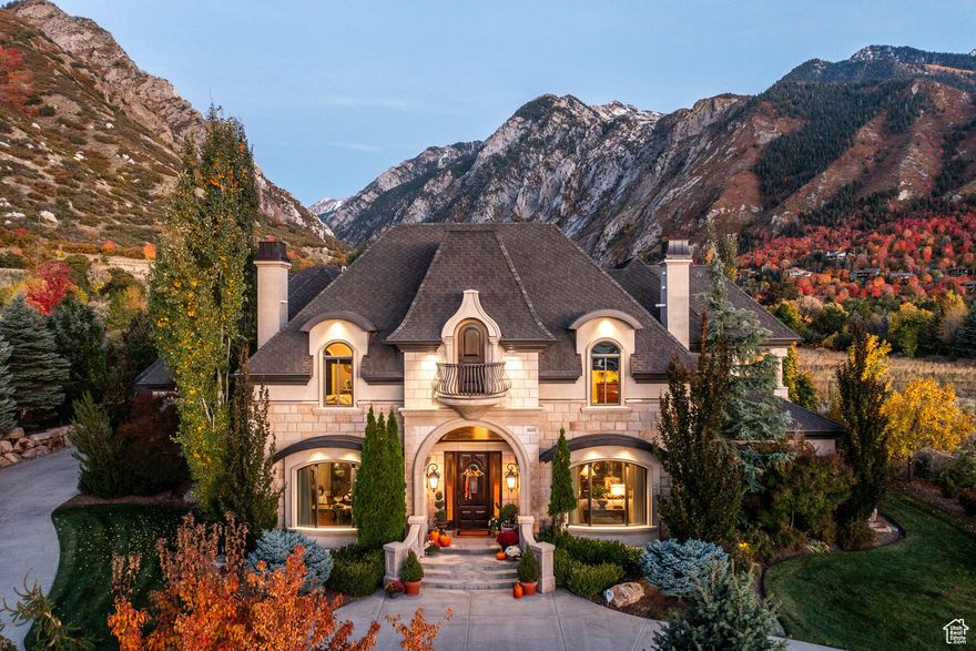 Nestled in the picturesque neighborhood of Granite Oaks and at the mouth of Little Cottonwood Canyon, this property stands as a testament to refined living. A harmonious blend of modern elegance and timeless design, this home boasts a commanding presence. The exterior, adorned with stone accents and manicured landscaping provides a desirable curb appeal. A circular driveway leads to a spacious 4 car garage, seamlessly integrating for convenience and usability. As you step inside, the interior unfolds with an open concept floor plan, limestone finishes, distressed walnut floors, custom finishes and materials throughout, and an abundance of natural light cascading through large windows, illuminating the stylish upgrades. The gourmet kitchen, adorned with granite countertops, limestone range hood, and state-of-the-art appliances, custom alder cabinetry make it a culinary haven. With multiple living spaces including a vaulted family room, main level office, workout facility, theatre room and a basement walkout allows this residence to effortlessly accommodate both intimate gatherings and grand celebrations. The primary suite is a sanctuary of tranquility, featuring a spa-like bathroom, cozy fireplace and double walk in closets. The backyard oasis, complete with a patio, lush greenery, and featuring a pool and spa that mirror the majestic mountains and provide an amazing serene retreat. Conveniently located near amenities such as top rated schools, World Class Ski Resorts including Snowbird and Alta, private and public golf facilities, hiking and biking...this location invites an active yet practical lifestyle. In every detail, this luxurious property epitomizes a home where sophistication meets comfort and also offers an unparalleled living experience in the heart of Sandy.